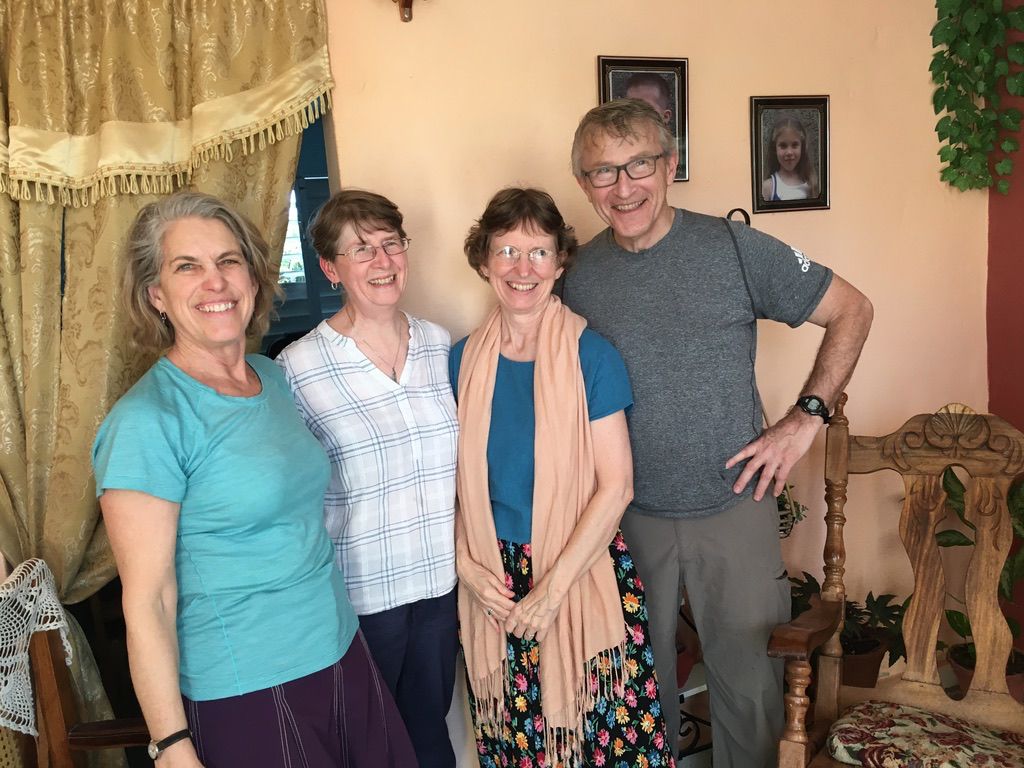 Photo of four Quakers: three women and one man