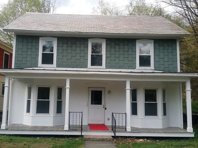 A photo of a freshly painted apartment building