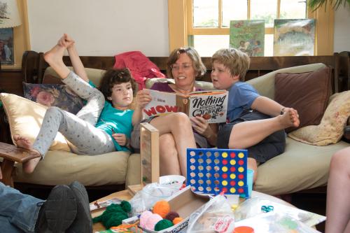 JYM staff and children reading books Janet Hamilton