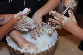 childrens hands covered in flour and dough